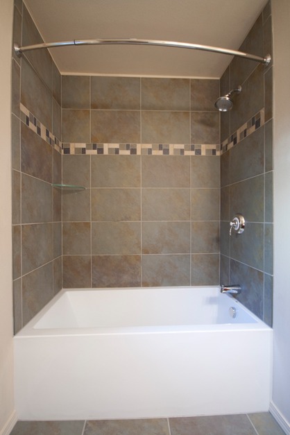 green slate porcelain tile, glass shelf, curved shower rod