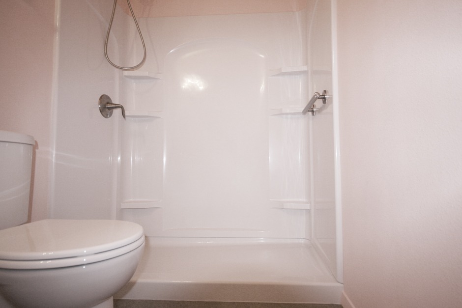 A 4-piece acrylic is a highly functional component of this complete bathroom remodel.