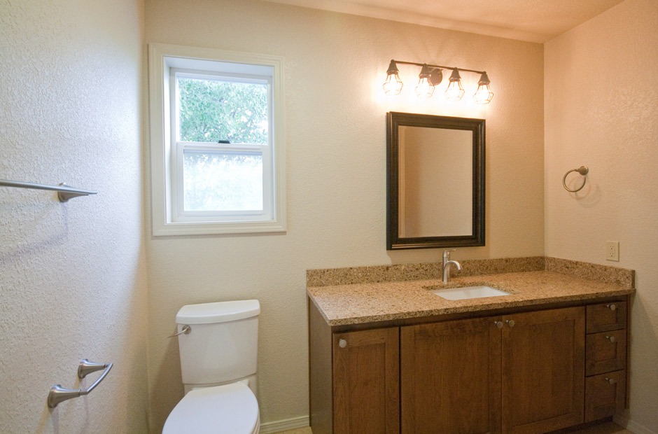 vanity, mirror, cage style sconce bath design