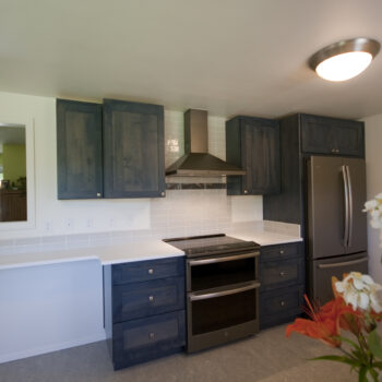 Blue cabinet kitchen with pass through