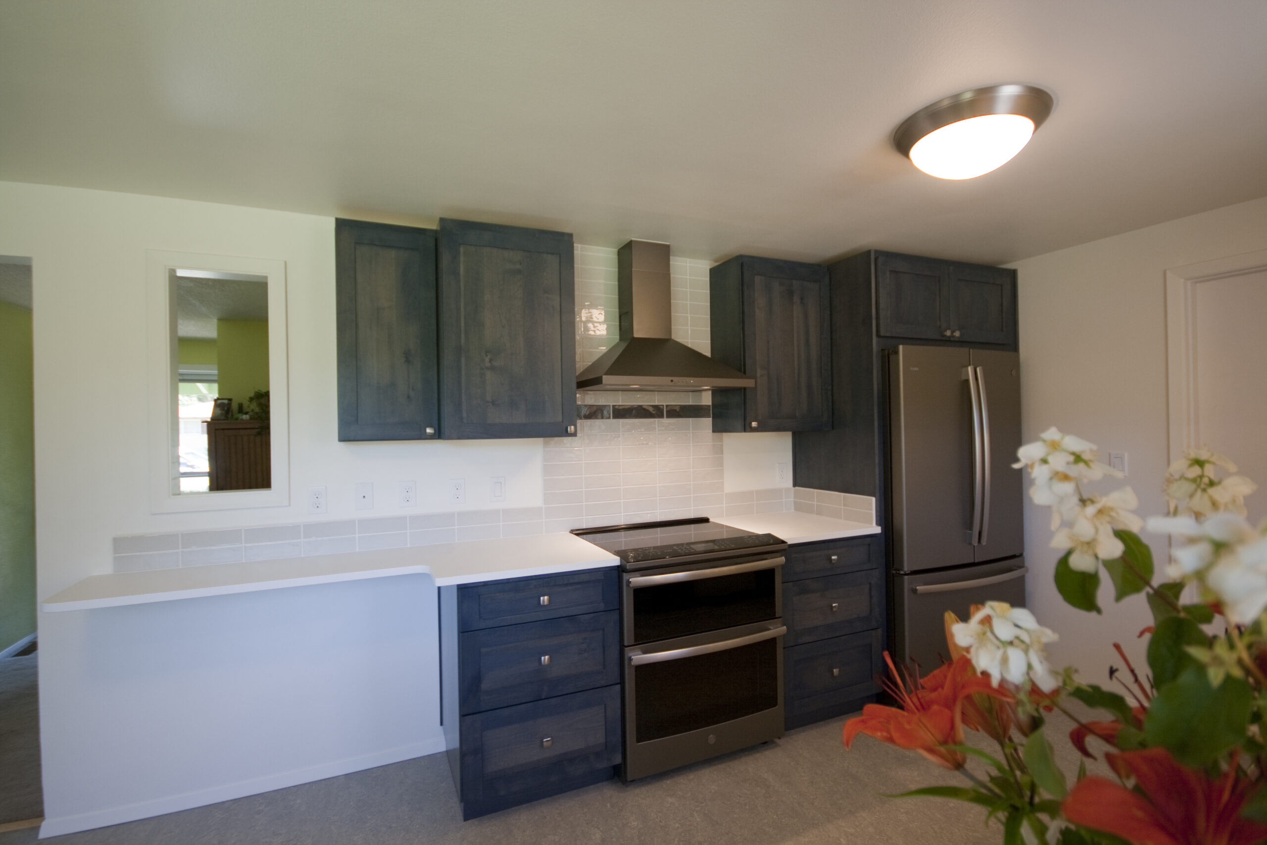 Blue cabinet kitchen with pass through