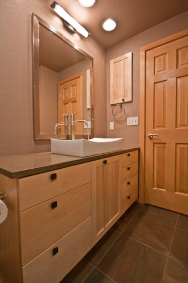 vessel sink and square black cabinet knobs