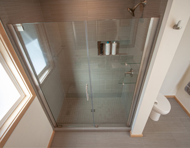 Heavy glass shower enclosure