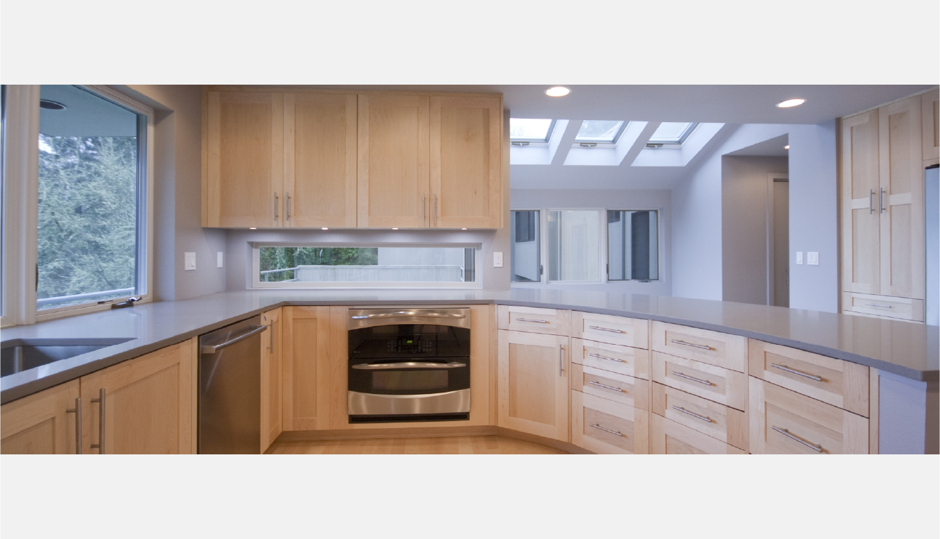 Double ovens and counter windows in kitchen