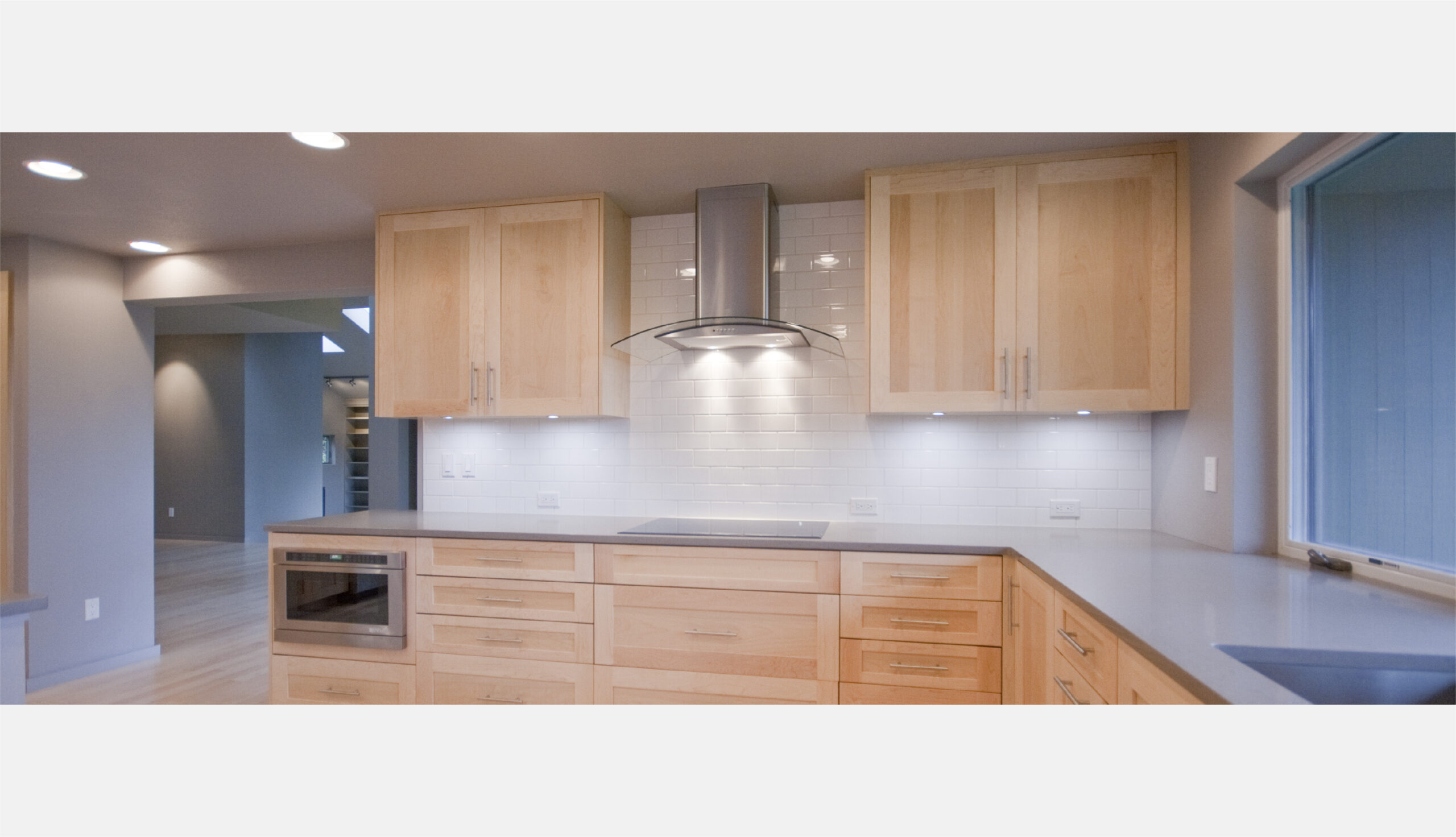 Cooktop with drawers underneath and subway tile backsplash