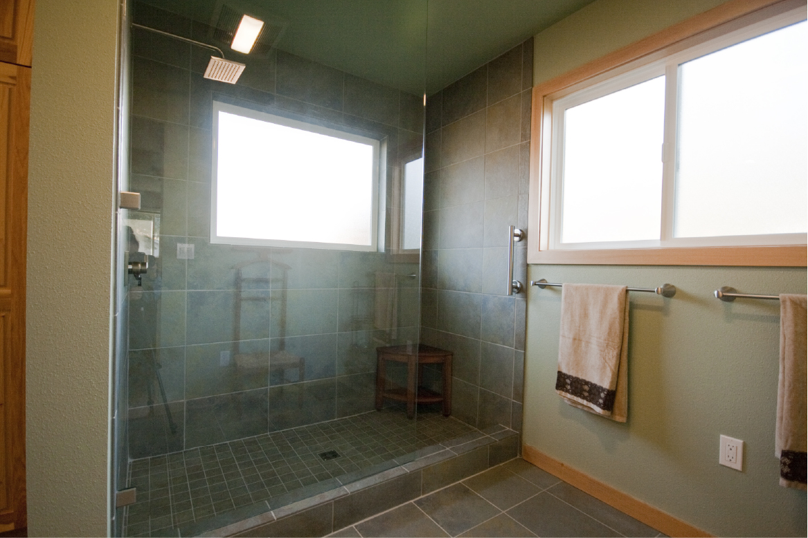 Slate-look porcelain tile shower, two windows