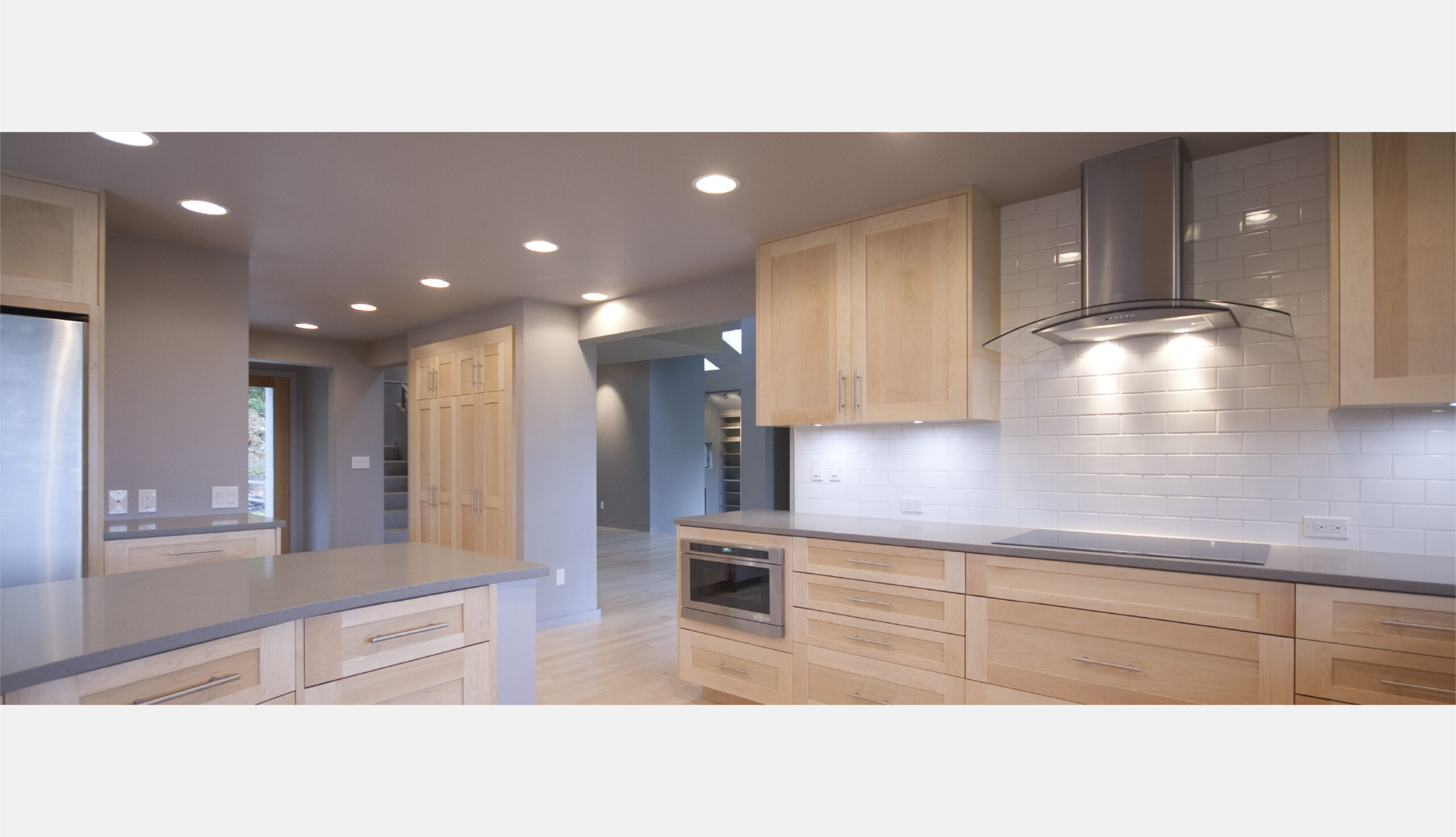 Kitchen, entry, living, and dining rooms.