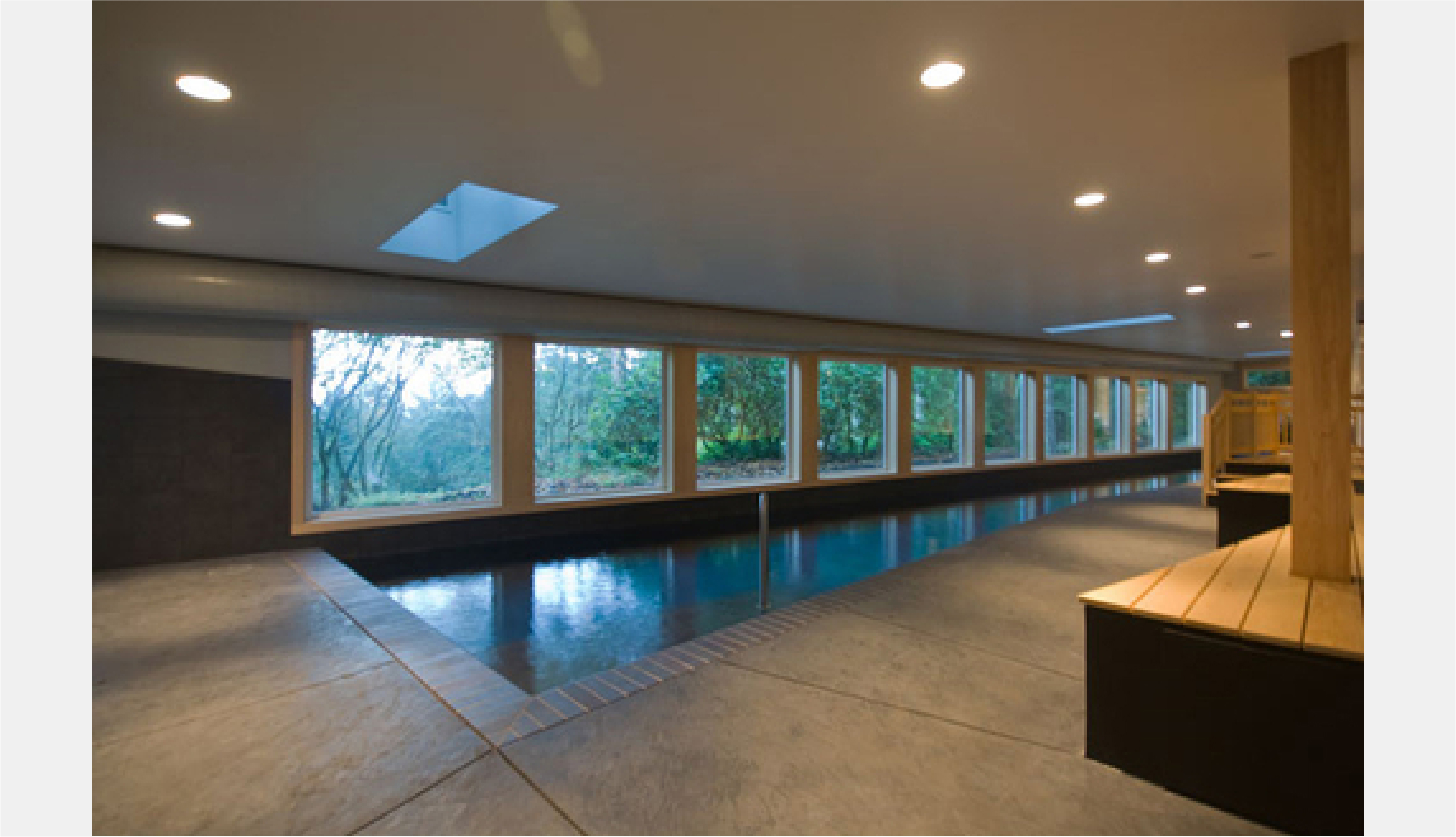 indoor swimming pool with hidden concrete columns providing shear value