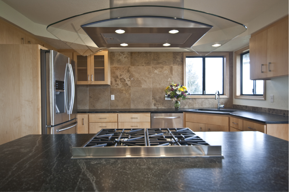 Dacor range and curved glass vent hood