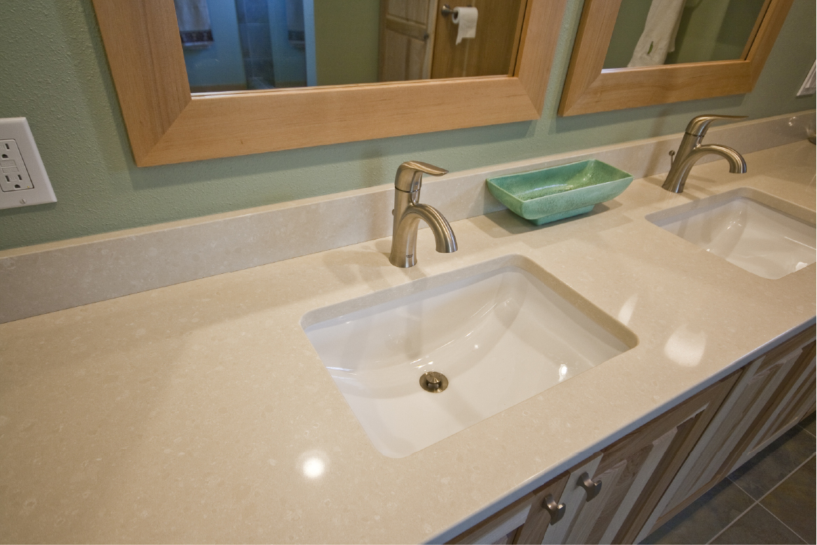 Caesarstone quartz counters with undermount sinks.