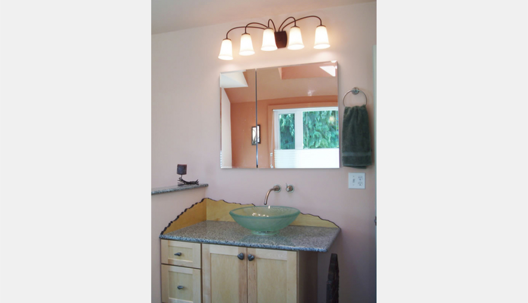 Mountain profile vanity backsplash and glass vessel sink