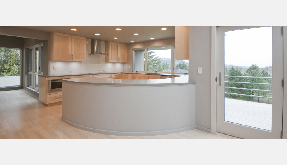 Curved kitchen island and subway tile backsplash