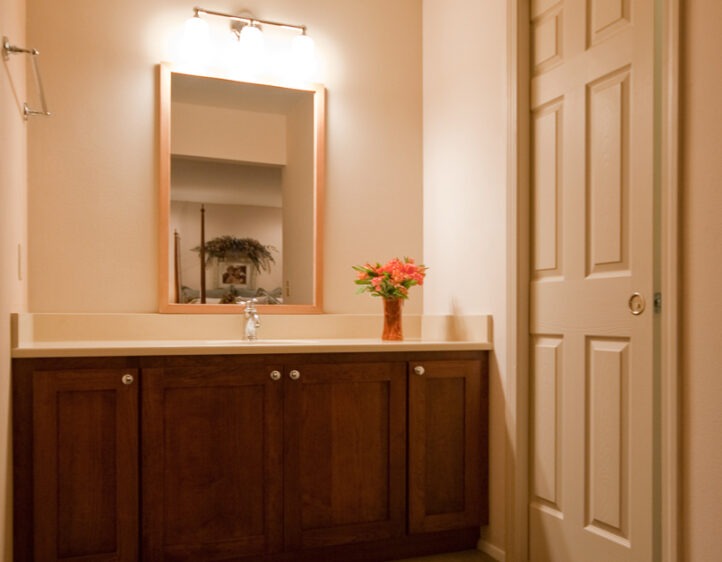 Re-made bathroom vanity area with custom CVG fir mirror frame.