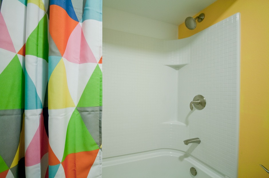 Close up of acrylic tub/shower unit with built in shelves