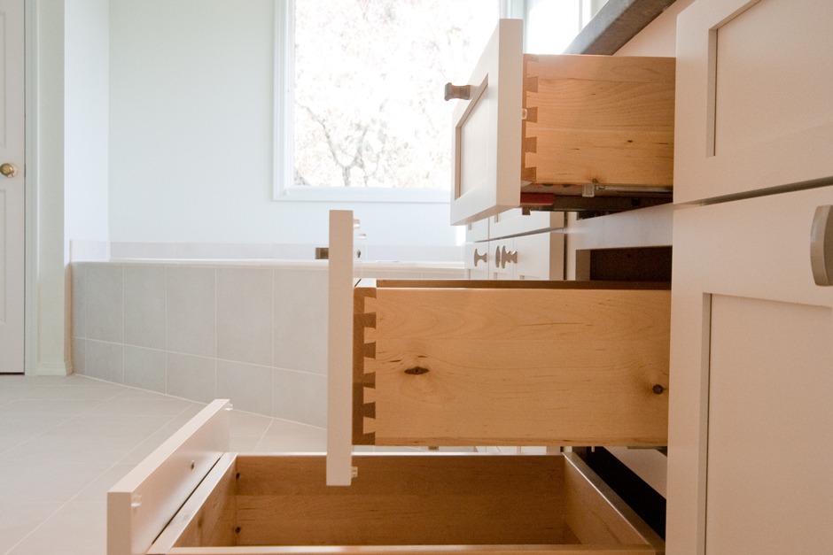 solid maple dovetail drawers in vanity cabinet + soaker tub by window