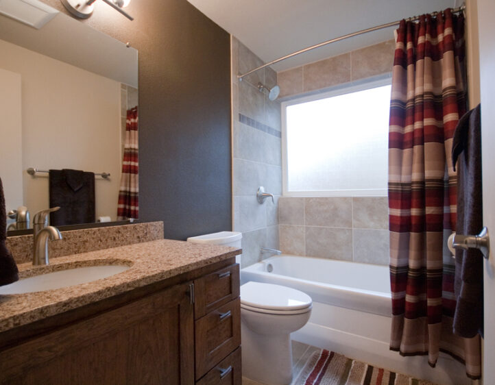 warm browns and reds bathroom remodel