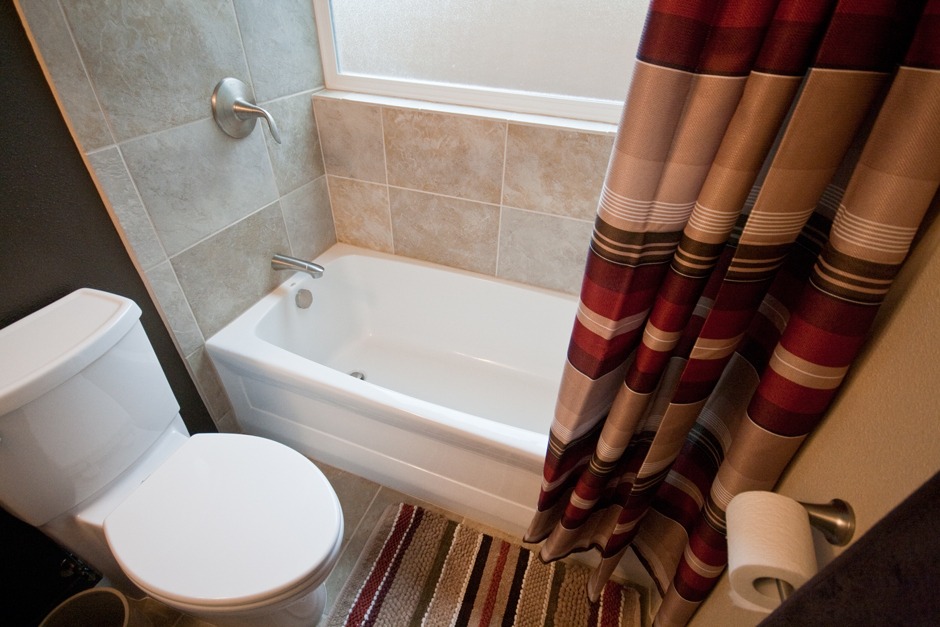 traditional styled bathtub in efficient floorplan bathroom