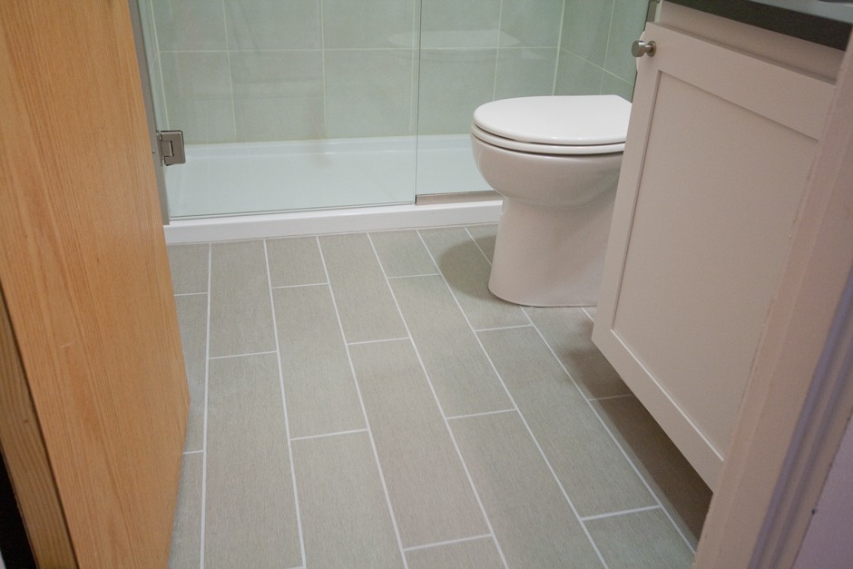 gray porcelain tile flooring in a bathroom remodel