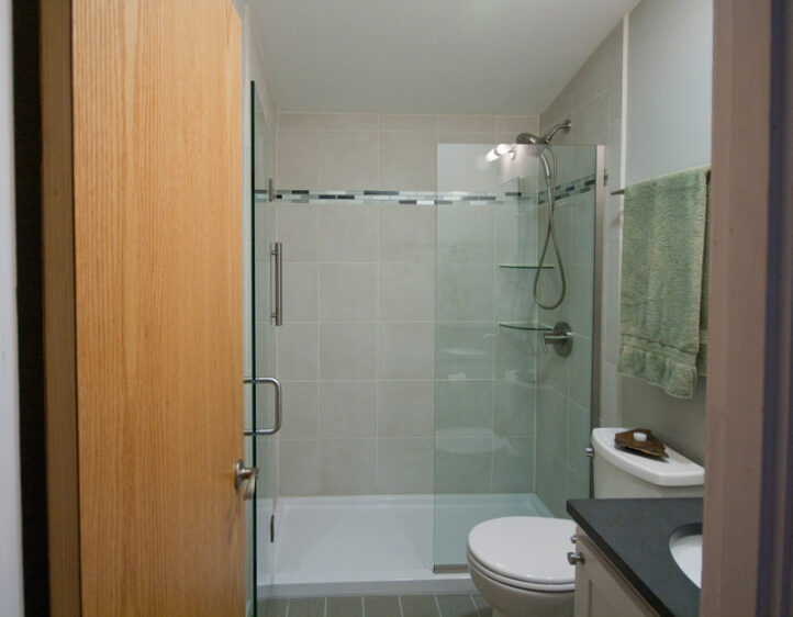 glass tile accent band, flush natural wood door