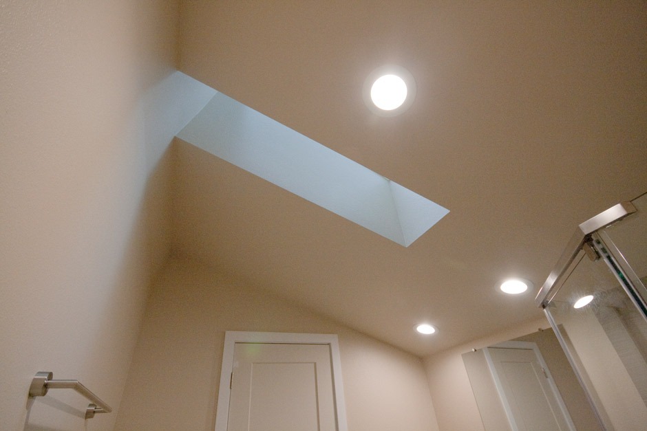 Skylight well in vaulted ceiling of bathroom remodel