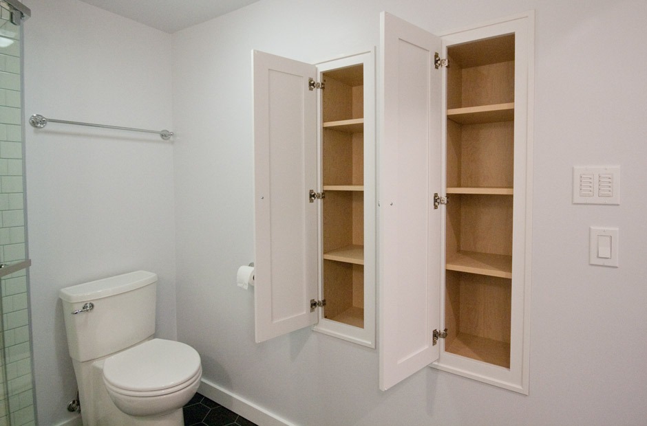 open wall cabinets in black and white bathroom remodel